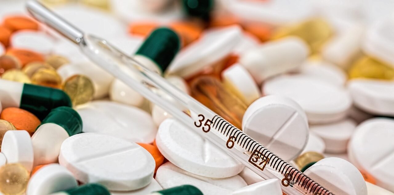 Pills and thermometer